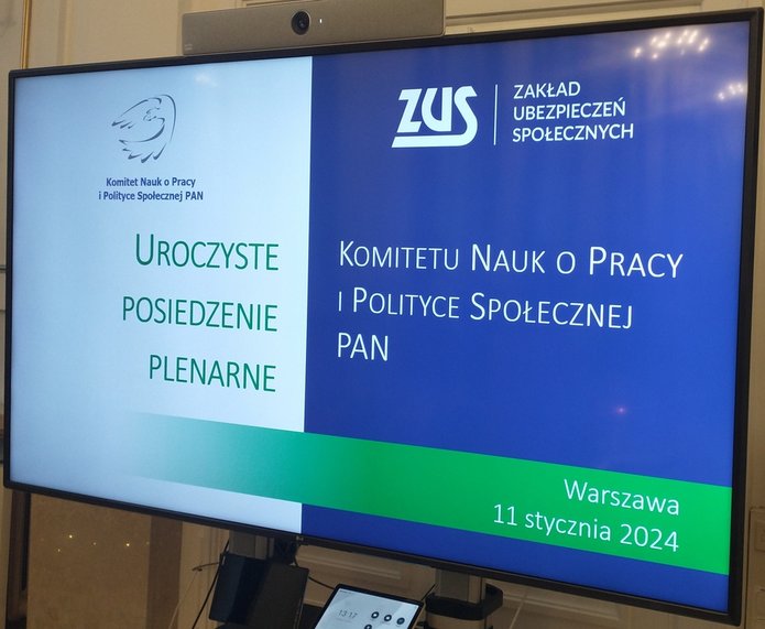 tablica informacyjna Komitetu Nauk o Pracy i Polityce Społecznej Polskiej Akademii Nauk